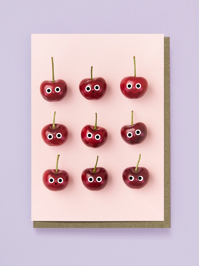 9 Red Cheery Cherrys on a Pink Background 