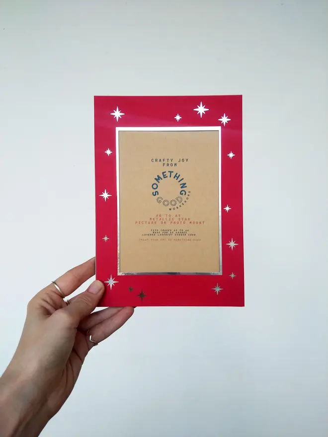 metallic star a5 / a4 christmas photo mount. red mount photographed against grey background.