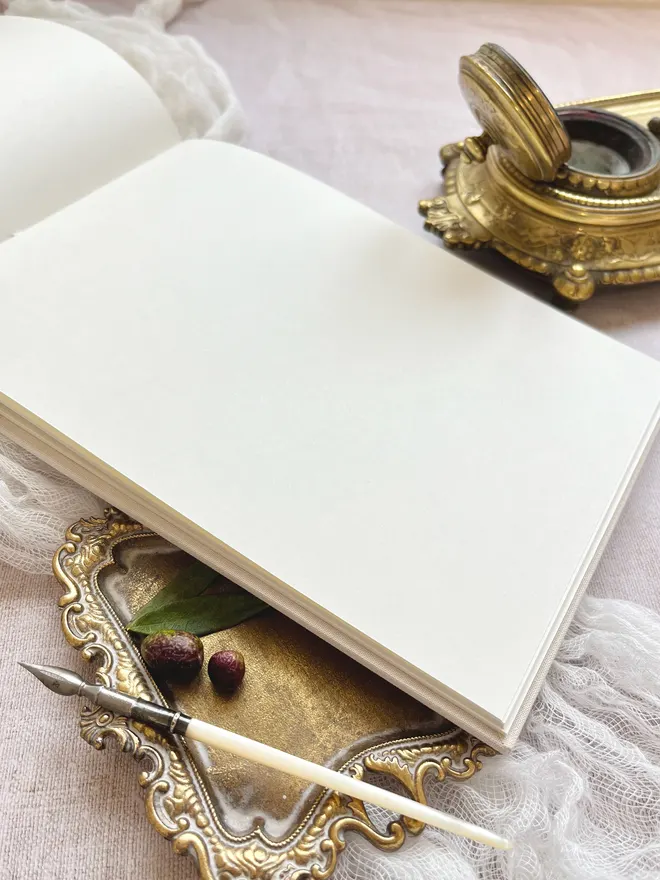 Inside pages of the guest book with plain pages of smooth ivory paper