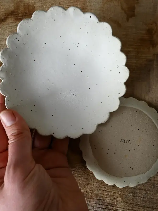 Handmade Scalloped Ceramic Dish, a pair of ceramic dishes on a wooden surface. 
