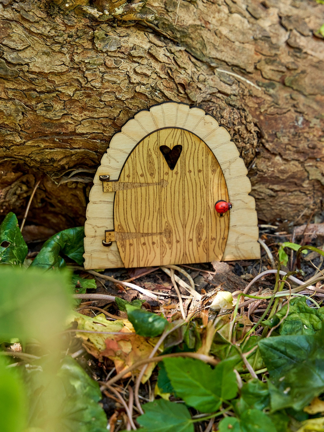 Birch wood fairy door. A wooden fairy door for kids engraved with a heart shaped detail on the front