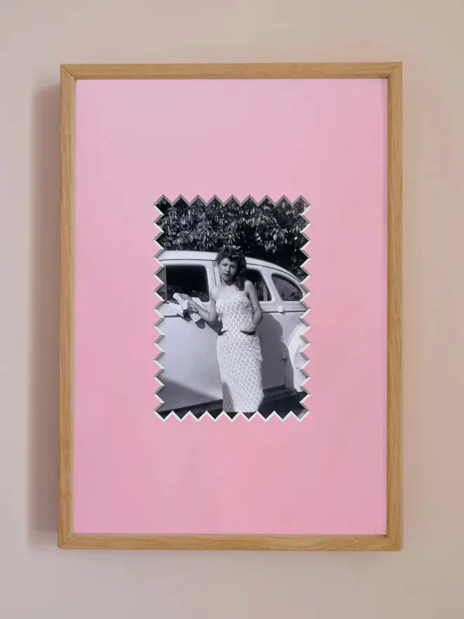 Ziggy photo mount frame ,displaying a centered portrait photo, hung on a neutral beige wall.