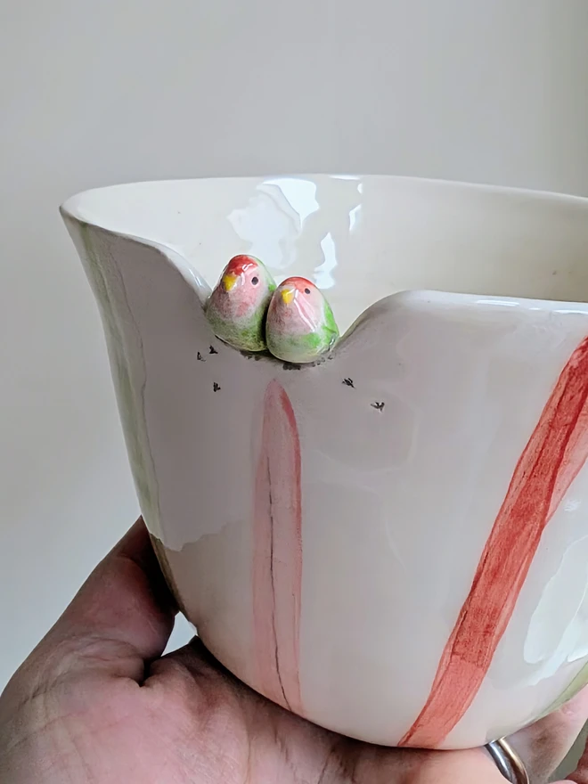 lovebird bird couple ceramic bowl or planter with pink, red and green stripes, hearts and splatters