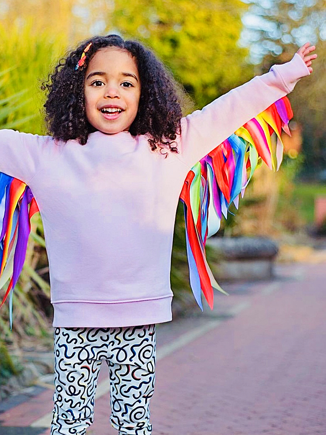 childrens organic sweatshirt with feather effect rainbow wings made from recycled fabric