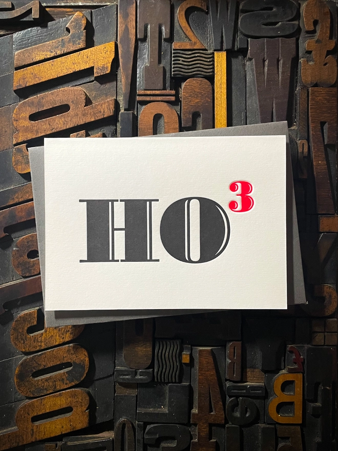 Ho Ho Ho! A beautiful typographic letterpress Christmas card. Printed in rich vibrant red and deep black inks with luxury matching and contrasting envelopes; ideal to send to your designer friends at the festive season.