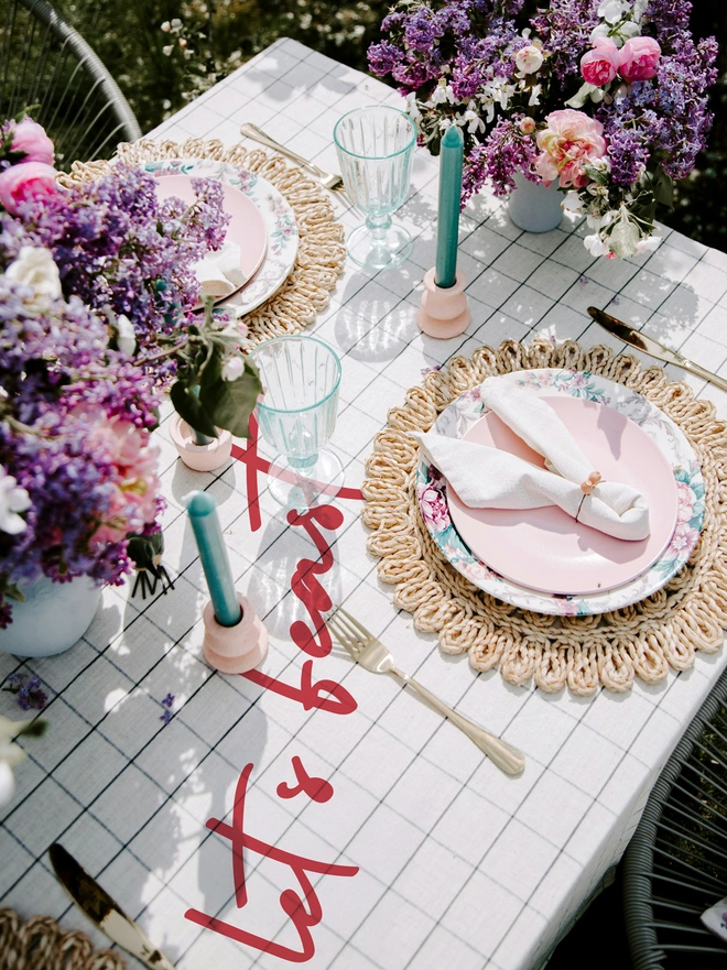 lets feast vinyl sticker on a chequered table cloth