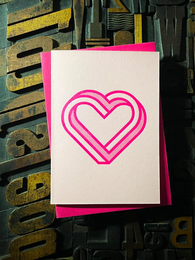 Valentine! A beautiful infinity heart monogram letterpress card printed with rich fluorescent pink ink on thick Candy Pink card with a luxury matching envelope; ideal to send a to a friend or loved one.