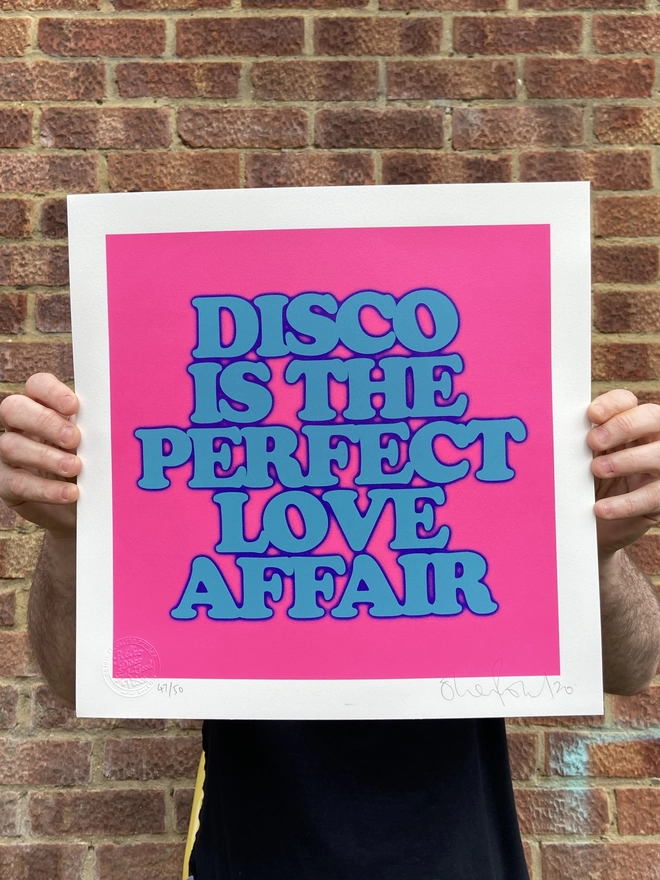 "Disco Is The Perfect Love Affair" Mini Screen Print with pink background and the words disco is the perfect love affair printed on top in blue 