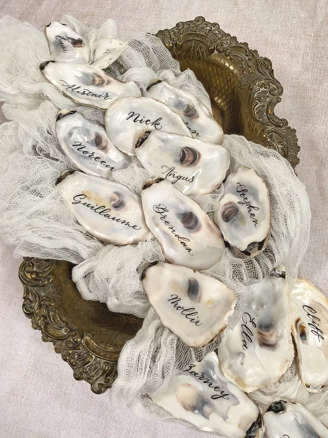 oyster shell place cards for weddings hand written in ink