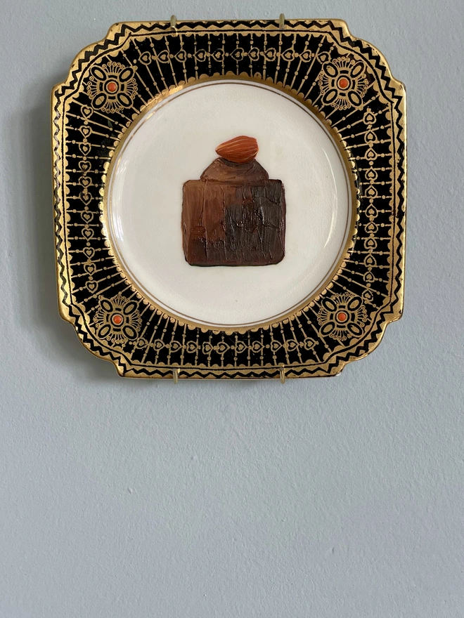 almond chocolate cake painting on plate