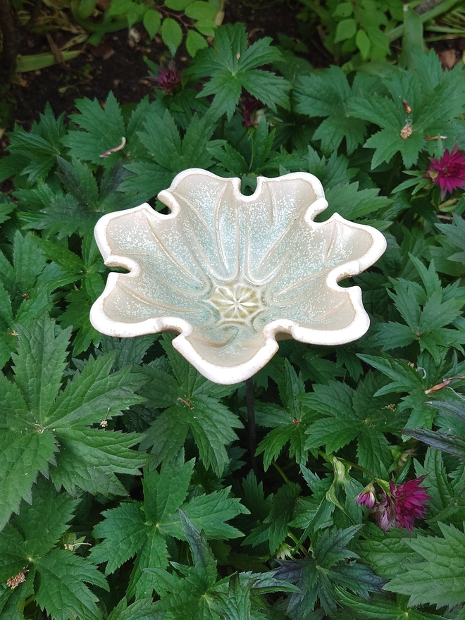 Seven petal ceramic flower bird bath on brass rod