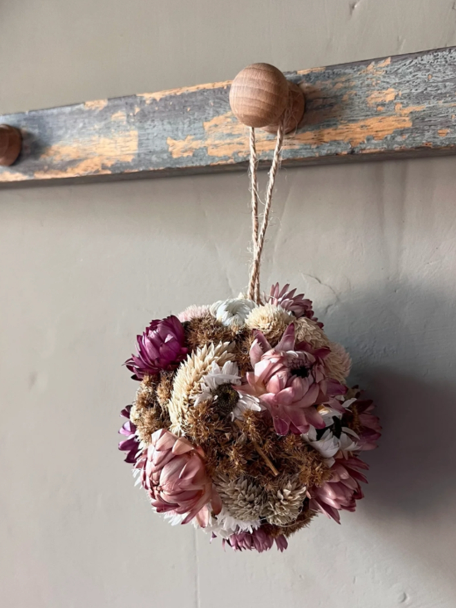 Purple Dried Flower Bauble. A bauble made of purple dried flowers.