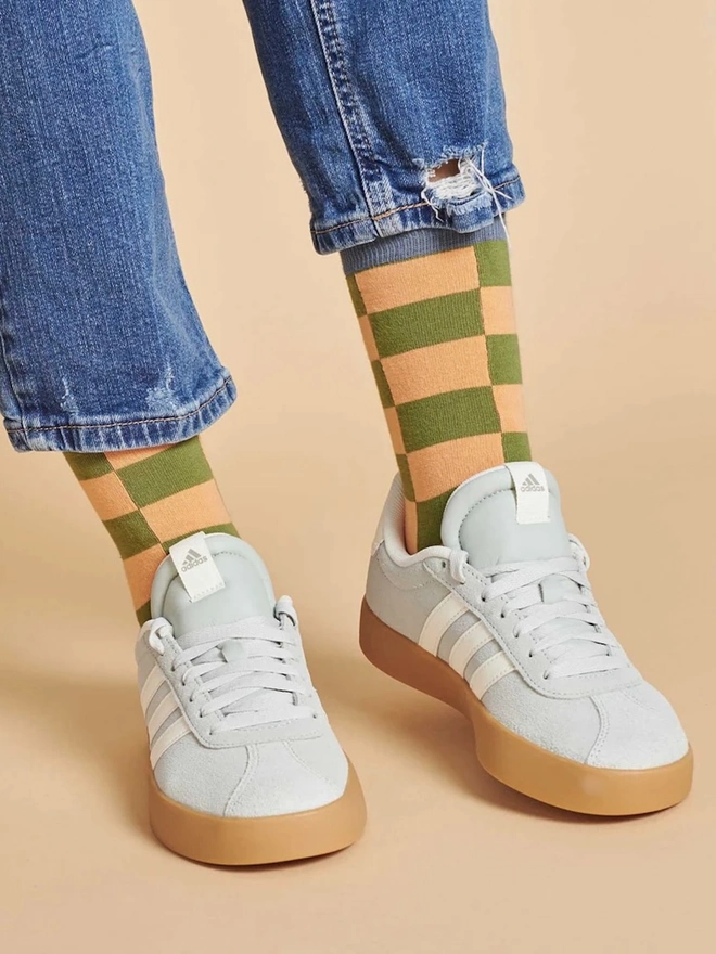 Women's Battenburg Organic Cotten Ankle Socks, a woman wearing a pair of colourful patterned socks. 