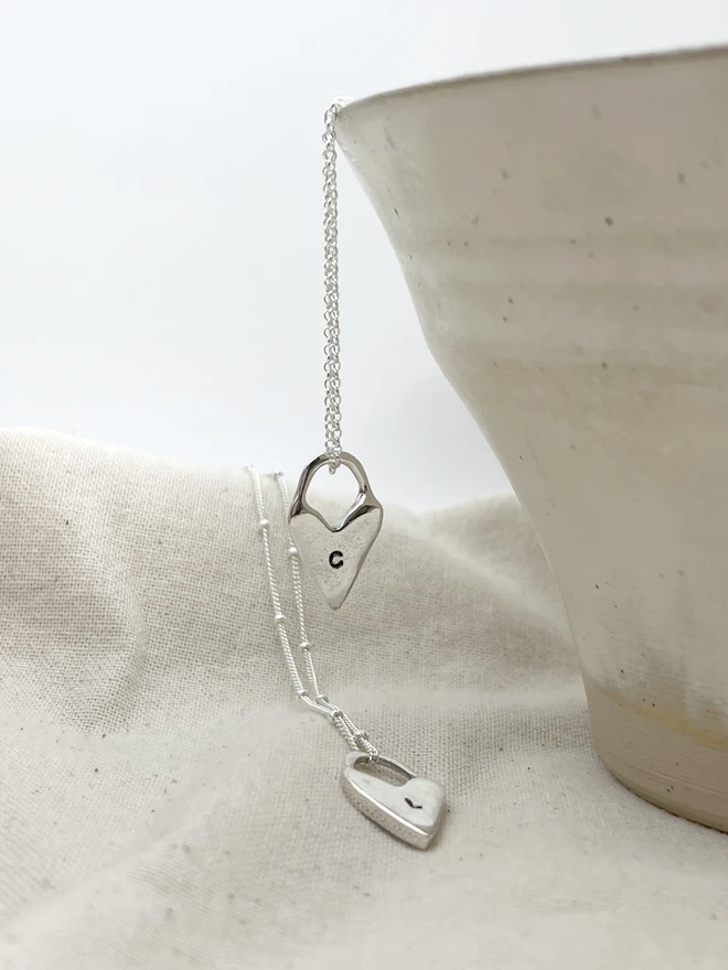 Hand made heart talisman charms made from 100% recycled sterling silver, cute gift for girlfriend or wife for Valentine's Day or Mother's Day. Send straight to your special someone. Made by Celina C Jewellery, a small business in the UK, find on Holly and Co.
