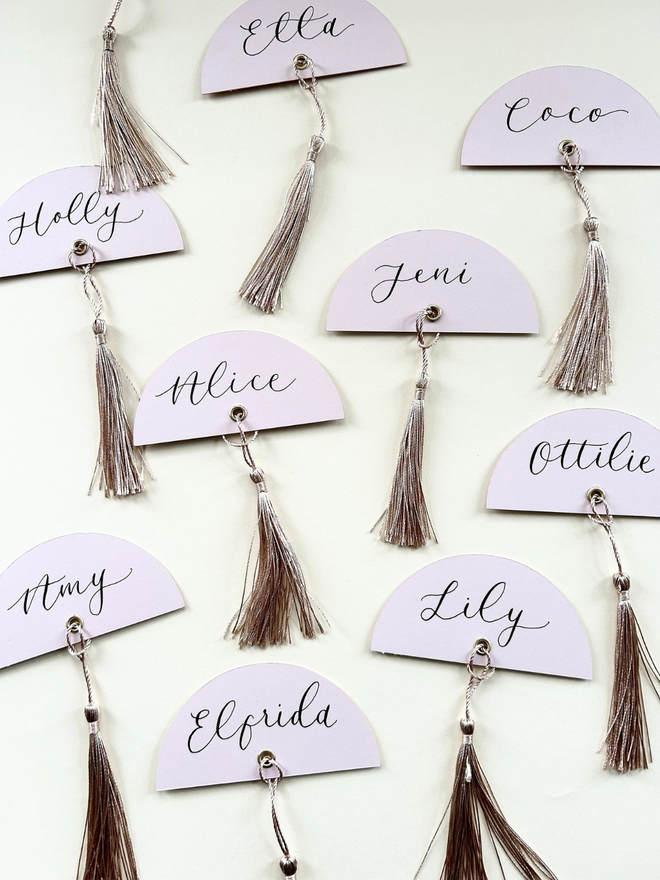 arch wedding place cards with tassels