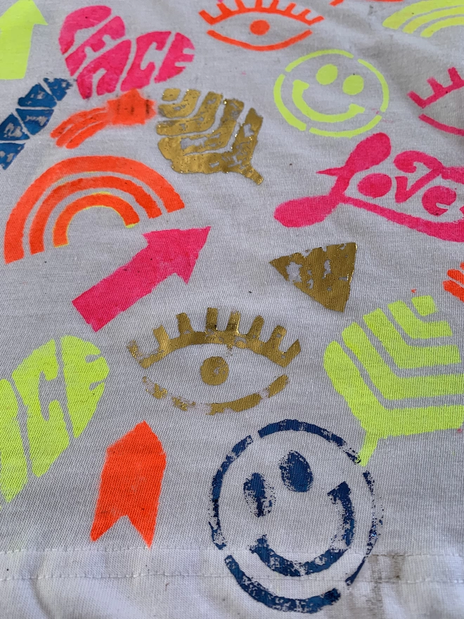Close up of festival t-shirt with ink design and metallic foil