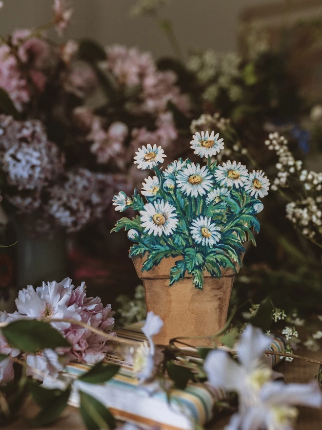 Wooden Daisy Pot, set amongst some fresh flowers