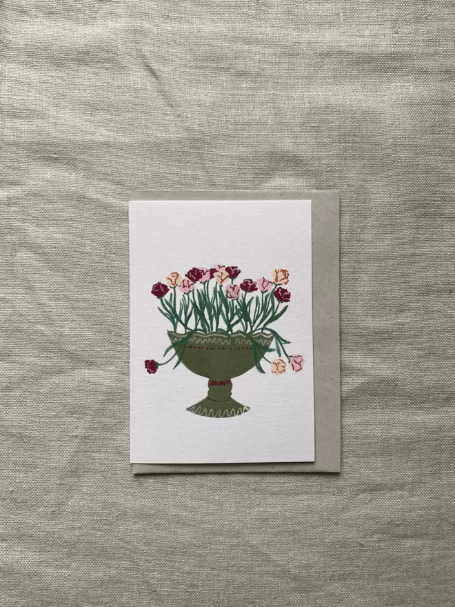 greetings card with parrot tulips in a green vase.