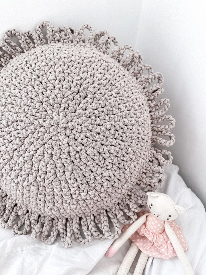 neutral sun crocheted cushion