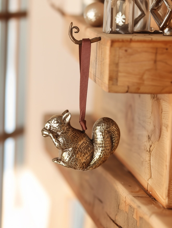 Squirrel Christmas Tree Decoration hanging on hook