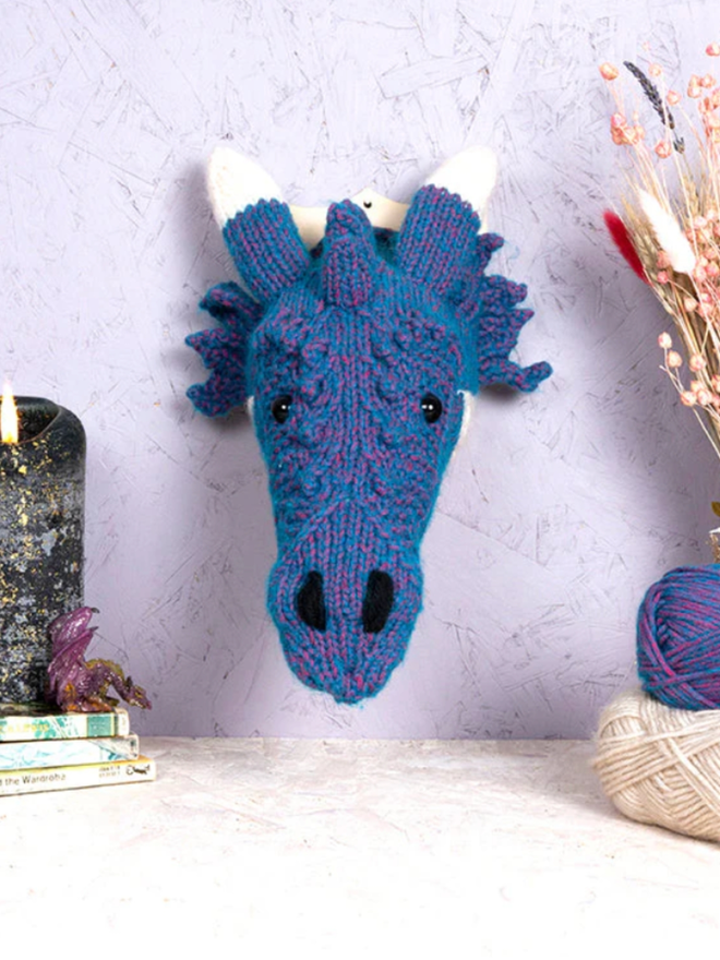 Dragon Head Knit Kit. A mini blue dragon head.