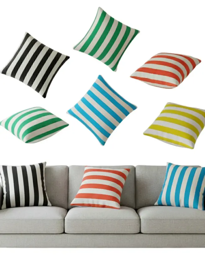 Hand Painted Sustainable Linen Cushion In Stripe Print, a collection of colourful striped cushions by a sofa in front of a white background. 