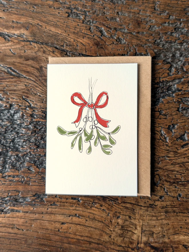 Small Christmas card with hand finished illustration of mistletoe