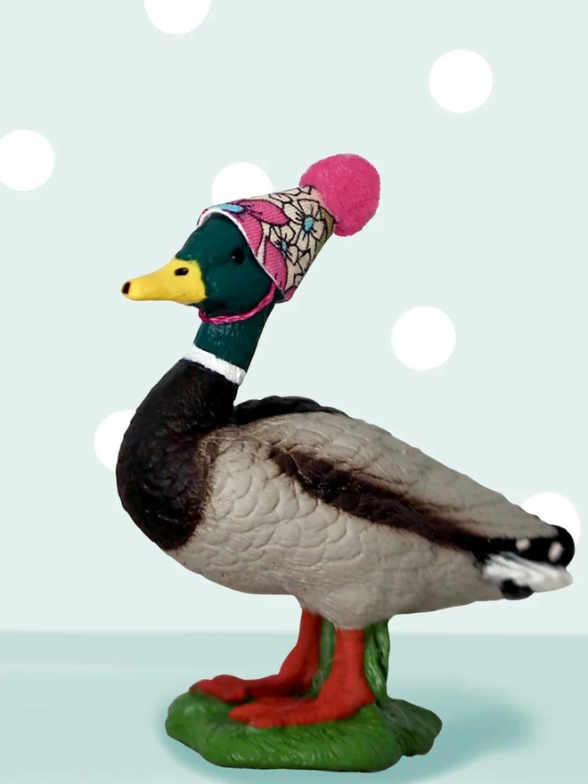 duck seen with a party hat.