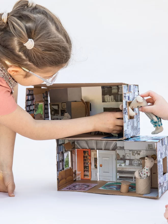 Home-Made House Craft Projects creating a house with collaged tiles on the outside to use for playtime with toys
