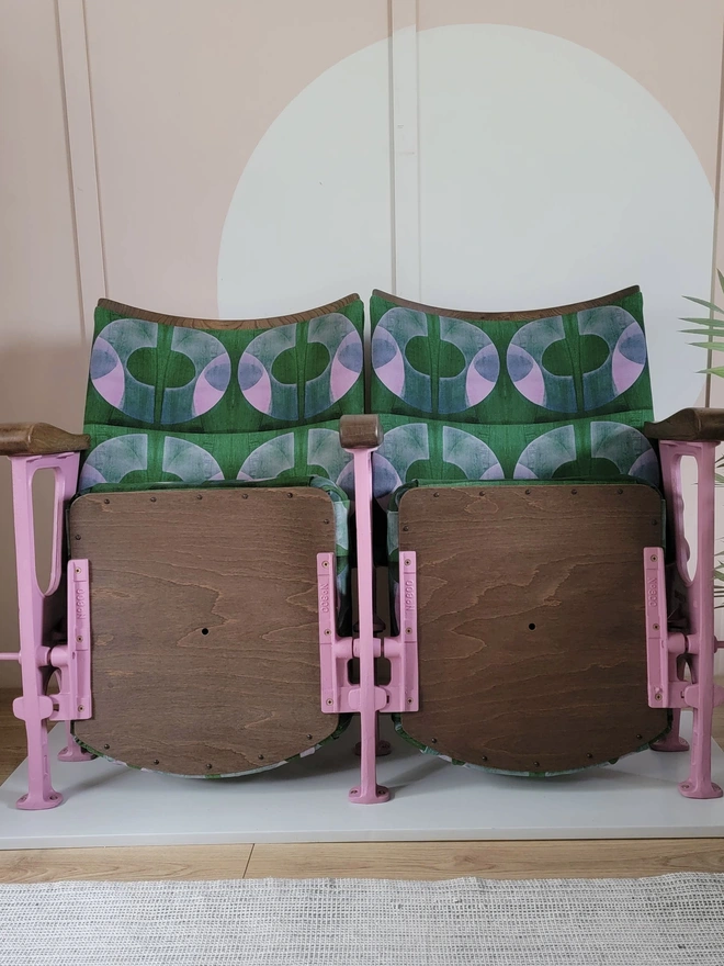 Pair of vintage cinema seats with flip up seats in pink and green velvet