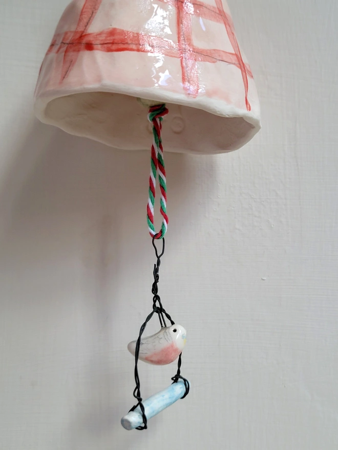 pink ceramic bell with budgie