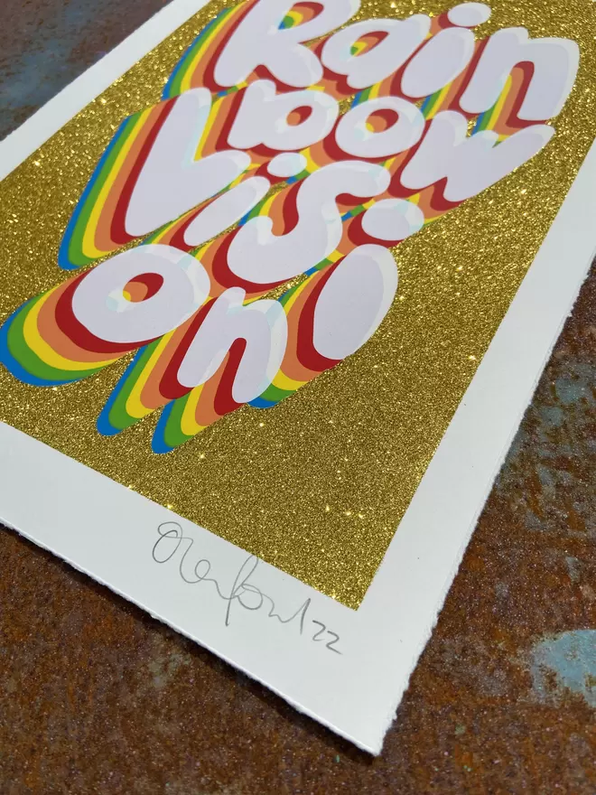 "Rainbow Vision" Glitter Hand Pulled Screen Print sparkling gold glitter back ground with the words rainbow vision printed on top with rainbow coloured layering 