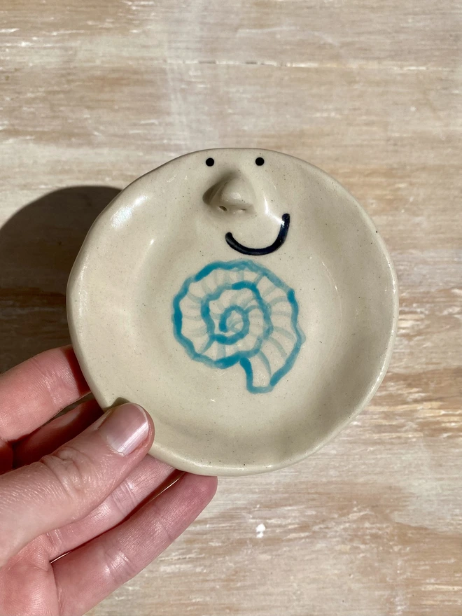 nautilus shell ceramic trinket tray - held