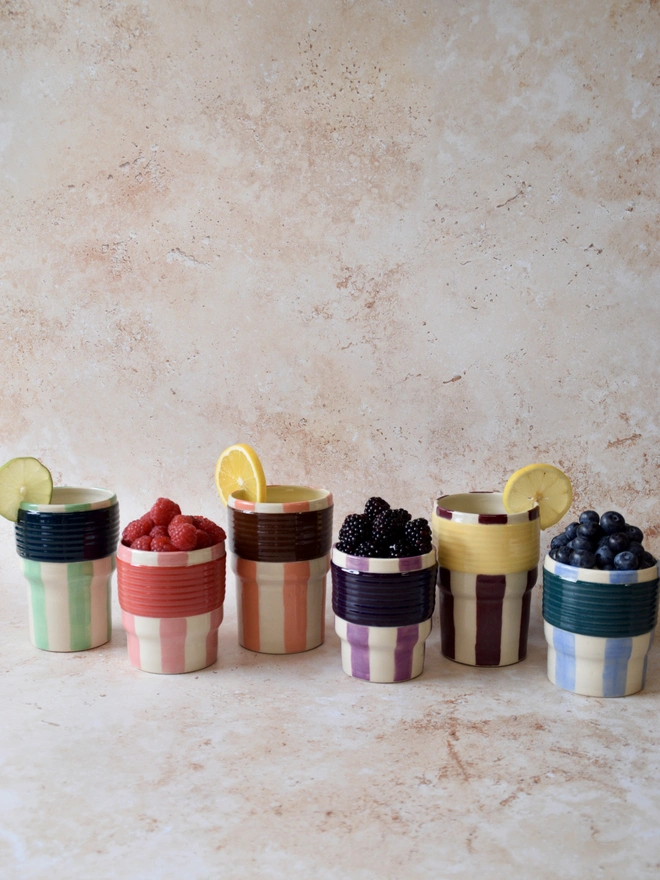     Handmade striped ceramic tumblers in different colourways