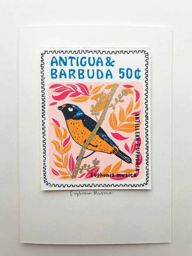 Bird Stamp Card Euphonia Musica Bird/Antigua & Barbuda, a white card with a colourful bird design on top of a white background. 