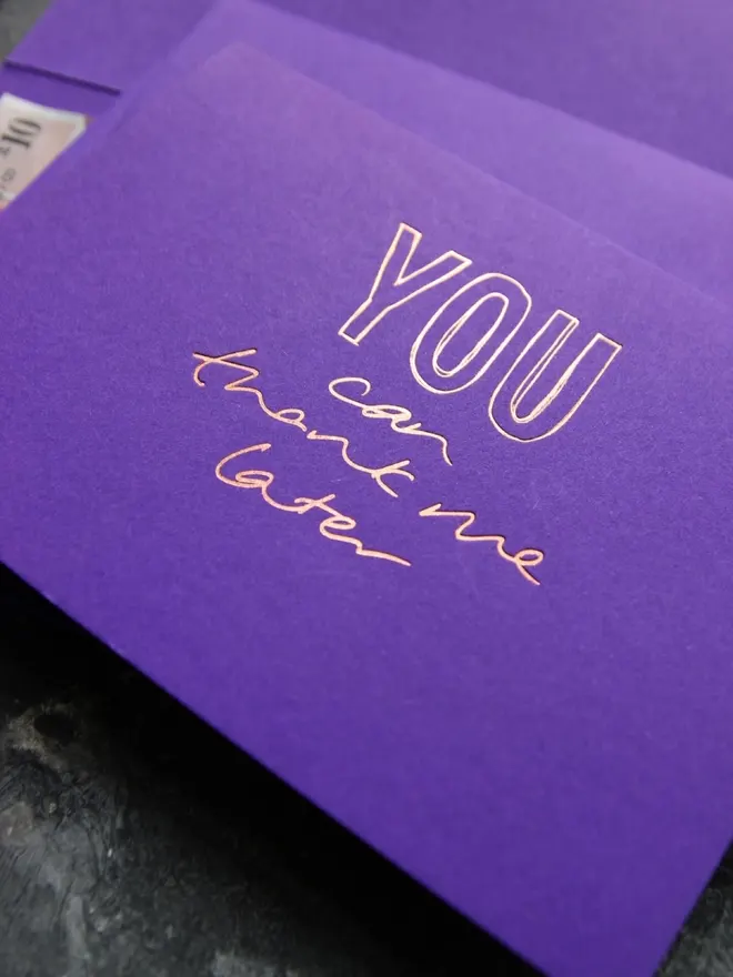 Hand foiled cash card or money wallet in a royal purple colour handfoiled in shiny rose gold foil text which says ‘you can thank me later’.