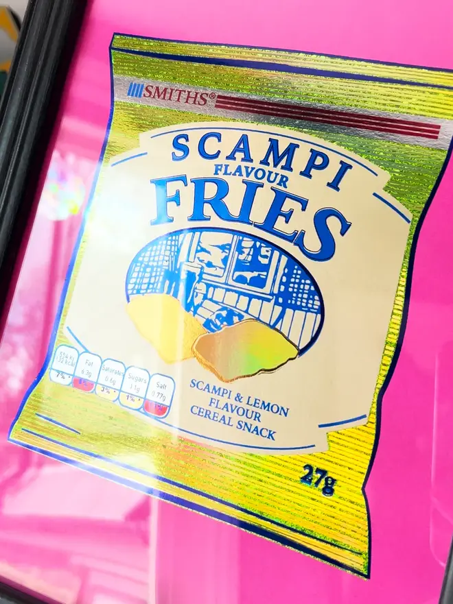 'Scampi Fries' ScreenPrint, a person holding a colourful scampi fries print in a frame. 