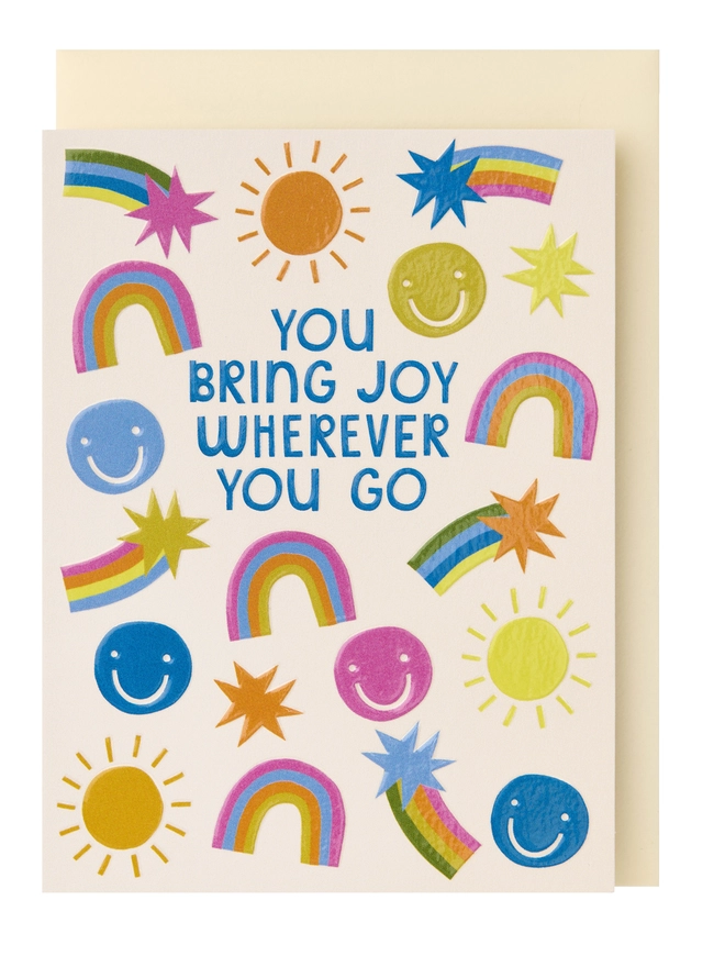 A colourful mini greeting card fearturing the test 'You Bring Joy Wherever You Go' surrounded by sun, smile , rainbow and shooting star illustrations