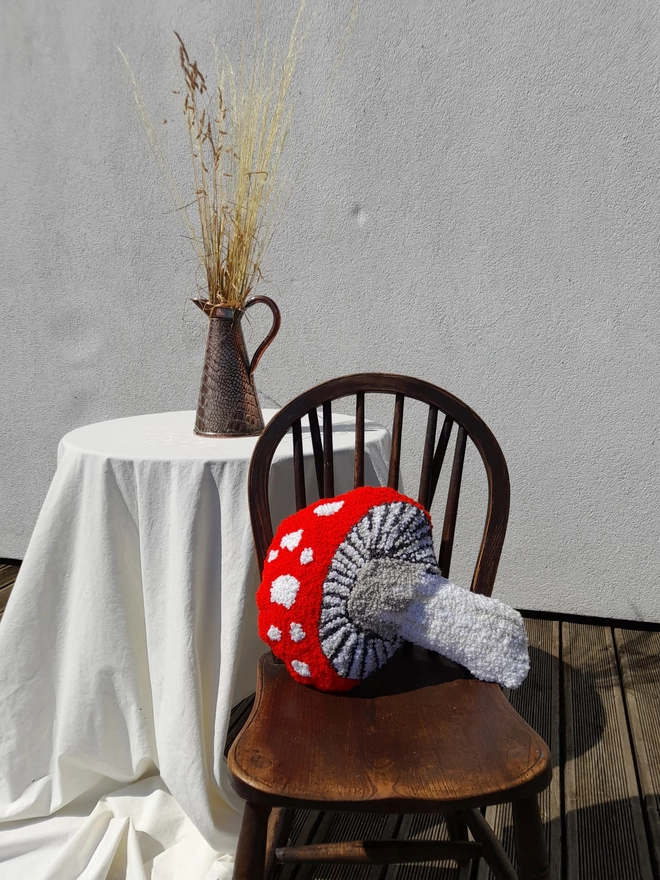 Funky Red and White Mushroom cushion on vintage wood chair