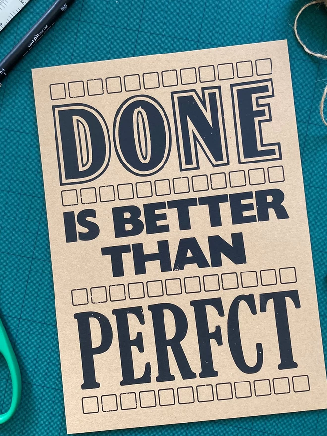 Done is better than Perfct Screen Print (blank ink on brown paper)
