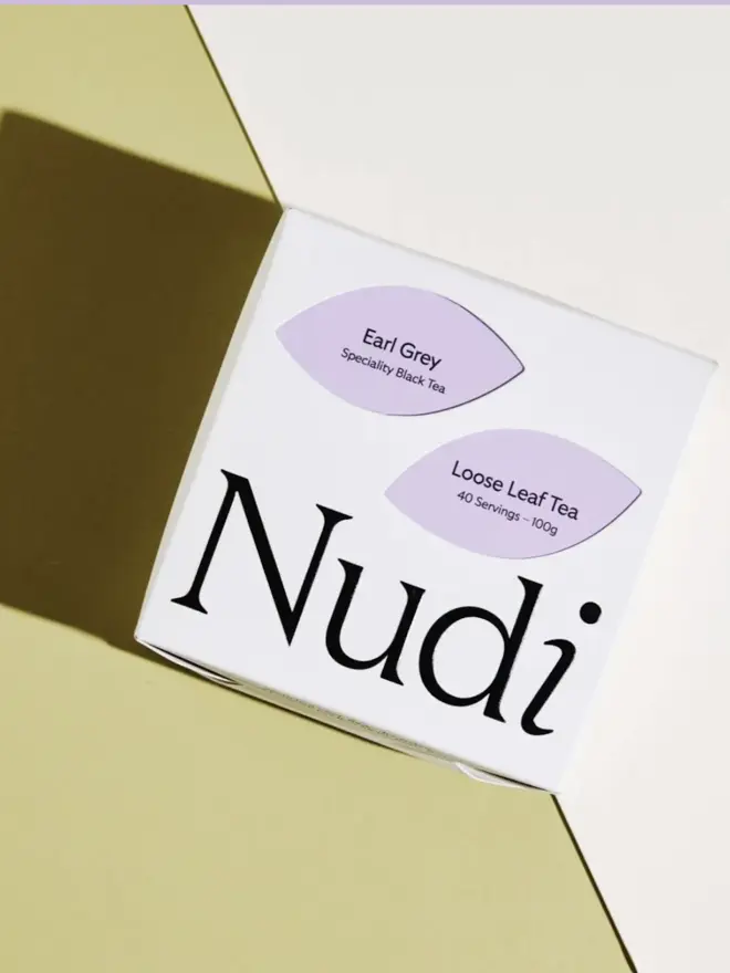 white box of tea with black and purple design