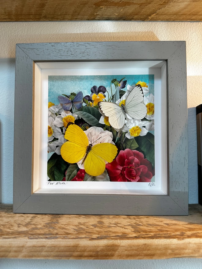 Spring floral art print with three paper hand cut butterflies in a light grey frame, personalised and signed on the front.
