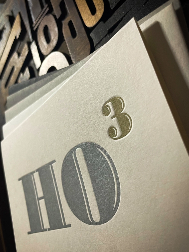 Ho Ho Ho! A beautiful typographic letterpress Christmas card. Printed in rich metallic silver and gold inks with luxury matching and contrasting envelopes; ideal to send to your designer friends at the festive season.