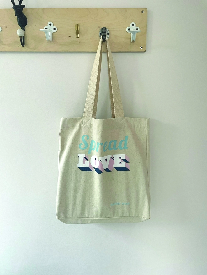 Spread Love Tote bag hanging