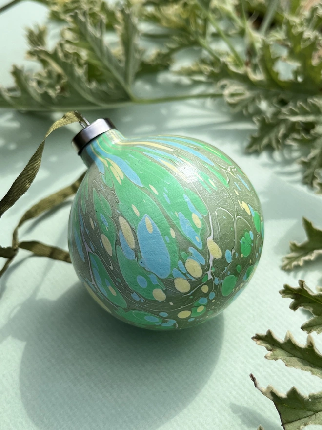 Hand-marbled round ceramic Christmas bauble