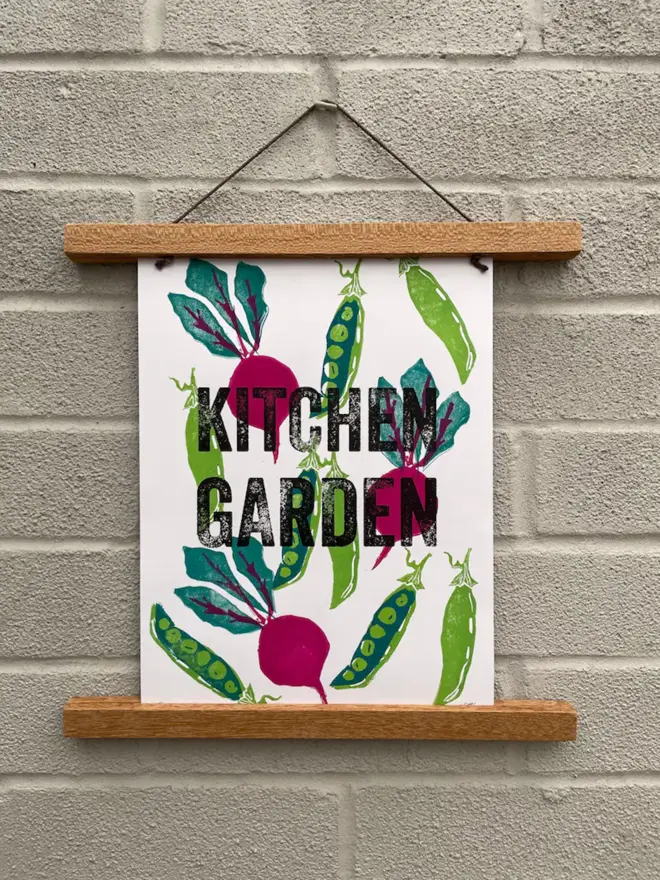Kitchen Garden print hanging on brick wall