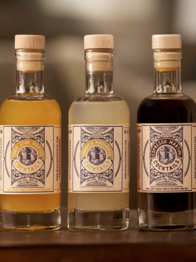 three bottles of cocktails, with tommys fizz logo