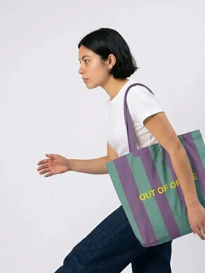 Out Of Office Tote Bag, worn by a woman, against a white background