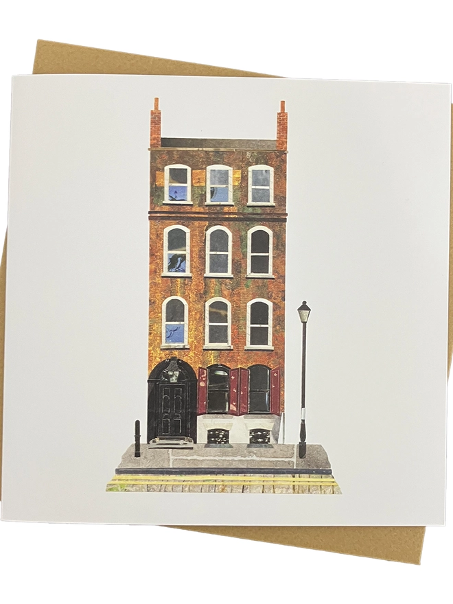Greetings Card with a collaged illustration of a Spitalfields townhouse with an envelope on a white background.