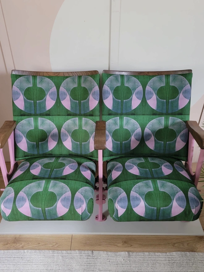 Green and pink Boucle velvet cinema seats seen from above